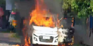 car with three people was set on fire in Vijayawada